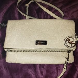 MK white fold cross body bag